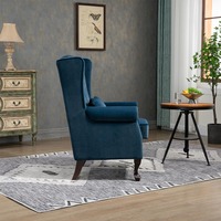 Fauteuil de salon en velours capitonné avec accoudoirs et structure en bois à vendre
