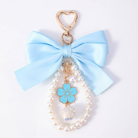 Porte-clés mignon avec nœud et perle, breloque étoile et lune, pendentif cœur plaqué or avec fermoir mousqueton, accessoire décoratif tendance pour sac, pochette ou téléphone, cadeau