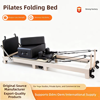 Lit de Pilates pliable en érable pour studio de yoga avec ensemble de résistance à ressorts pour les programmes d'étirement et de tonification