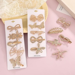 Juego de pinzas para el cabello estilo coreano con diamantes de imitación, pinzas laterales de aleación con perlas, mariposa, lazo, corazón, estrella, para uso diario, hechas en China. - Product Image 1