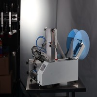 Machine d'étiquetage semi-automatique manuelle de haute qualité pour bouteilles rondes et sachets