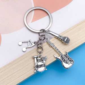 <span class=keywords><strong>Funky</strong></span> <span class=keywords><strong>Music</strong></span> Guitar Rack Drum Pop Instrument Llavero de metal Juguetes minimalistas Llaveros para amantes de la música Colgante - Product Image 2