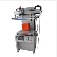 Grande machine de sérigraphie semi-automatique pour l'impression d'étiquettes sur des seaux pour animaux de compagnie