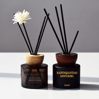 Bouteille diffuseur d'arômes en verre rond noir mat 100ml 120ml en stock, bouteille d'aromathérapie sans flamme avec bouchon et bâtonnets en bois