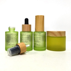 ขวดแก้วทรงแบนสีชมพูแบบกำหนดเองขนาด 1 ออนซ์ พร้อมหลอดหยด 30 มล. 50 มล. สำหรับบรรจุเซรั่มบำรุงผิวหน้า น้ำมันหอมระเหย บรรจุภัณฑ์สำหรับผลิตภัณฑ์ดูแลผิว พร้อมบริการสกรีนพิมพ์ - Product Image 5