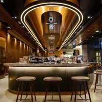 Comptoir de bar commercial éclairé en marbre au design moderne personnalisé pour restaurant, bar à vin et bar à jus