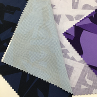 Haute élastique 85% Nylon 15% Spandex Check Design tissu imprimé numérique résistant à l'eau à séchage rapide pour les vêtements de sport pour garçons