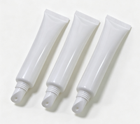 Tuyau souple en plastique extrudé pour huile à lèvres, transparent laiteux givré, avec embout biseauté et bouchon, contenant vide pour brillant à lèvres, en vrac