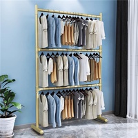 Nordique moderne métal Double barre pliant vêtements tige de suspension audacieux Double couche sol levage sec support Simple nordique salon