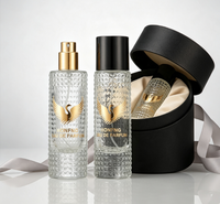Boîte cadeau cylindrique personnalisable avec couvercle noir, flacon de parfum en verre transparent vide avec pompe pulvérisateur et design perforé, 30ml 50ml 100ml