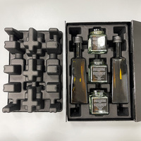 Boîtes cadeaux personnalisées en carton avec insert en pulpe moulée, couvercle et base, pour bouteilles d'huile d'olive, de miel, de caviar et de confiture.