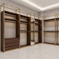 Porte-vêtements mural de luxe en métal doré avec panneau imitation bois, pour boutique, avec tiroirs de rangement, certifié ETL