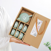 Vente en gros Service à thé Kung Fu carpe céladon Pot en porcelaine de six tasses Boîte cadeau compagnon d'activité au design chinois pour service à café