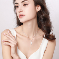 Collier pour hommes et femmes, chaîne avec cœur d'amour, en pierre magnétique, bijou de couple, nouvelle mode,