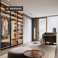 Armoire en verre minimaliste italienne de luxe sur mesure avec éclairage LED et coiffeuse intégrée pour chambre à coucher et aménagement de dressing