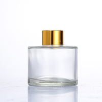 Diffuseur de parfum en verre noir de luxe 50ml/100ml/150ml/200ml avec bouchon couronne et impression sérigraphiée dorée pour aromathérapie