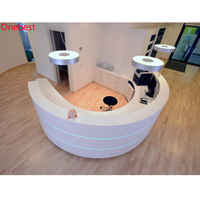 Comptoir de réception de salle de sport sur mesure, design unique, comptoirs de réception ronds en pierre avec éclairage LED