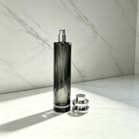 Flacon de parfum en verre transparent de 50 ml, forme ronde et longue, avec bouchon pulvérisateur argenté pour l'emballage d'huiles parfumées