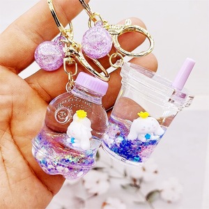 Porte-clés en acrylique avec liquide et <span class=keywords><strong>sable</strong></span>, motif Cinnamoroll chien bleu aux grandes oreilles, jouet en peluche flottant, petit pendentif dessin animé mignon irrégulier - Product Image 3