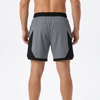 Shorts de sport décontractés pour hommes, design OEM ODM, blocs de couleur, taille élastique avec cordon de serrage, poches latérales, longueur au-dessus du genou, pour la course et l'entraînement