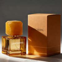 Conception de niche bouteille de parfum transparente jaune bouteille en verre de 50ml avec bouchon en pierre de couleur assortie boîte-cadeau personnalisée