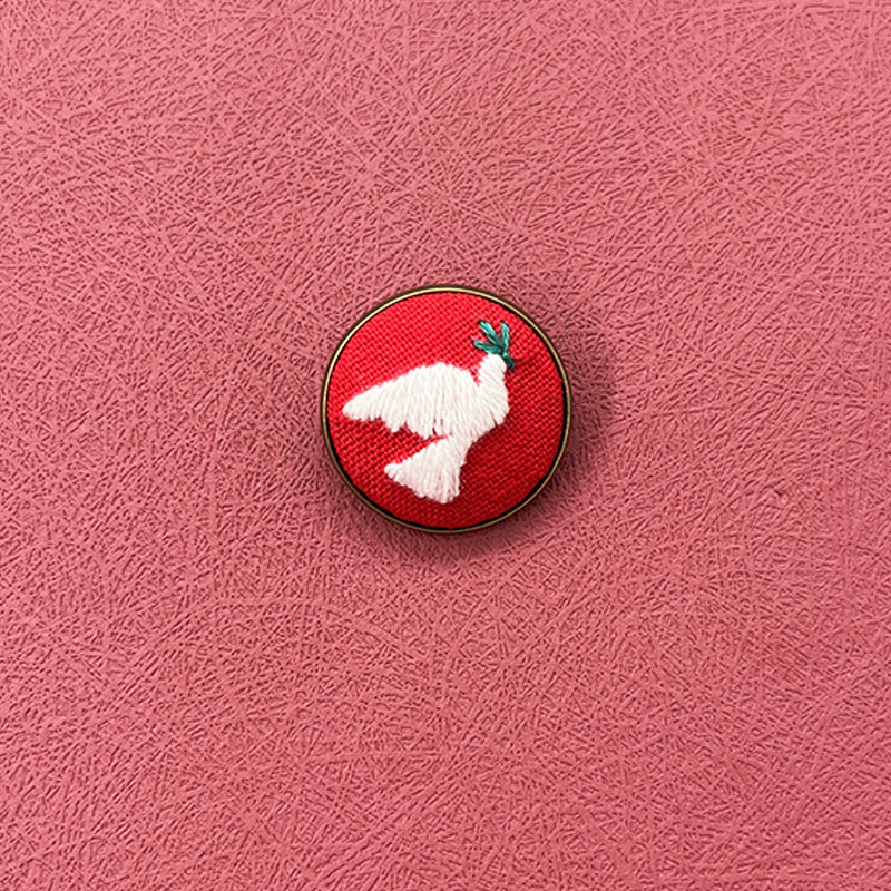 Peace dove lapel pin-plastic hoop-25mm diameter