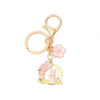 Nouveau porte-clés en métal de dessin animé bricolage mignon petit lapin fleur de cerisier frais porte-clés sac pendentif cadeau pour fille