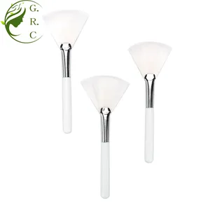 Özel Logo cilt bakımı Mini üçgen kozmetik fırçalar üreticileri beyaz yüz pudra fosforlu maskesi Fan makyaj fırçası