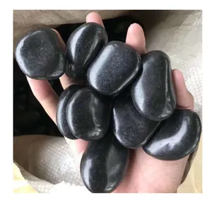 Polished river rocks black pebble stone for landscaping
