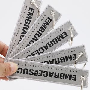 Porte-clés Jet Tag personnalisé avec logo et message de motivation, pour marques lifestyle, articles de collecte de fonds pour organisations non-profit, étiquettes de vol - Product Image 1