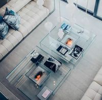 Table basse de salon de luxe artistique en verre trempé transparent, design italien minimaliste et créatif
