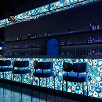 Comptoir de bar d'hôtel de luxe à arc circulaire rétro-éclairé agate en cristal bleu naturel bureau de réception en pierre translucide