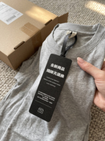 Étiquettes de vêtements noires personnalisées inviolables avec sceau de sécurité à usage unique, impression sérigraphique blanche sur tissu scintillant pour marques de vêtements
