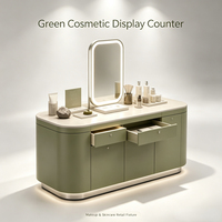 Armoire de présentation de maquillage verte sur mesure avec tiroirs de rangement éclairés par LED, adaptée aux magasins de parfums et de cosmétiques haut de gamme