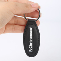 Porte-clés personnalisé en cuir marron avec logo imprimé et étiquette cousue pour entreprise de transport routier