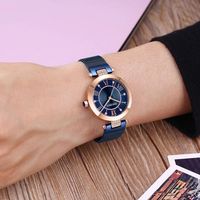Montre-bracelet pour femme avec bracelet en maille, chiffres romains, index en cristal, cadran soleil et barrettes en T, style habillé