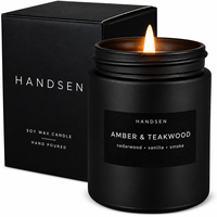 Pot à bougie en verre noir avec boîte assortie, surface mate et étiquette texturée pour les intérieurs modernes, la création artisanale et les cadeaux haut de gamme