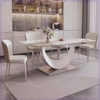 Table à manger de luxe effet marbre blanc avec base en U unique et 6 chaises de salle à manger
