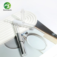 Tube de brillant à lèvres double embout transparent et électroplaqué au design populaire, emballage cosmétique vide en plastique en gros