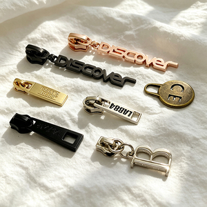 Custom <b>gold</b> letter multi-purpose zipper head bag decorative logo replacement zipper head metal nylon slider zipper tag - Product Image 3