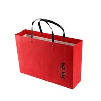 Sacs-cadeaux sacs en papier de Noël de luxe personnalisés OEM emballage raisonnable avec nœud et logo à prix d'usine