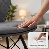 Chaise de salle à manger grise moderne avec dossier ergonomique, assise rembourrée matelassée et pieds en acier noir pour la fourniture de mobilier B2B