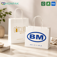 Sac de shopping en papier personnalisé HONPAK avec poignée blanche et impression de logo pour l'emballage des magasins de marque