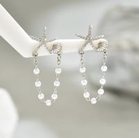 Damenohrringe - Kleine sternförmige Muschel mit Perle. Ohrringe mit Hochwertigem Stil und Vielseitiger Ausstrahlung.