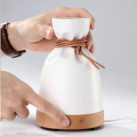 Diffuseur d'arômes créatif en forme de pochette avec base en bois, humidificateur ultrasonique d'huiles essentielles, attache en cuir pour chambre, spa, boutique, cadeau