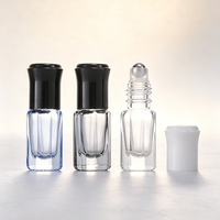 Flacon compte-gouttes octogonal en verre teinté vide avec bille roulante pour le stockage d'échantillons d'huiles essentielles et de parfums