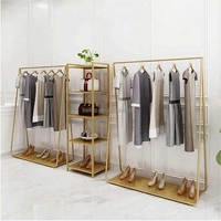 Étagères mobiles de gondole de magasin de vêtements pop moderne personnalisée magasin de vêtements au détail présentoir de t-shirts avec roue