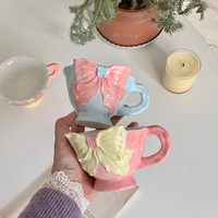 Tasse à café et thé en céramique en forme de cœur, style coréen Ins, mignonne, moderne, blanche, avec nœud noir Hepburn, écologique, 350 ml, avec soucoupe pour fête