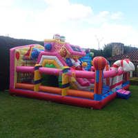 Château gonflable géant d'extérieur unisexe combiné avec toboggan Terrain de jeu gonflable Candyland pour s'amuser