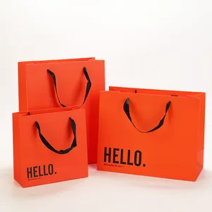 Bolsa de lujo personalizada para ropa, embalaje rosa de regalo, bolsas de papel de embalaje de compras con asas